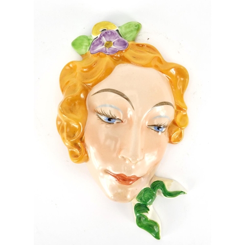 561 - Czechoslovakian Art Deco pottery face mask of a female, impressed 15380 to the reverse, 22cm high