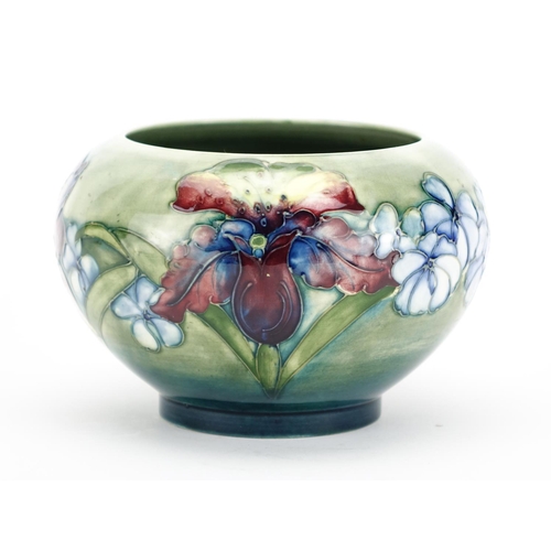 538 - Moorcroft pottery footed bowl, hand  painted and tube lined in the Orchid pattern, impressed and pai... 