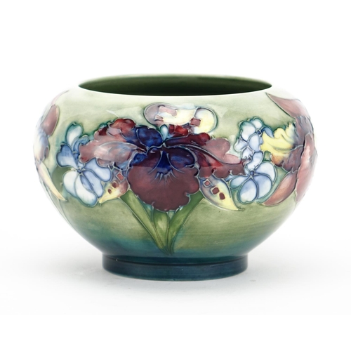 538 - Moorcroft pottery footed bowl, hand  painted and tube lined in the Orchid pattern, impressed and pai... 