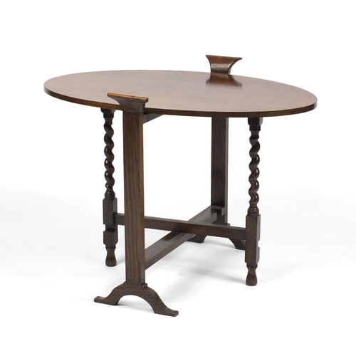 83 - Oval oak gate leg folding occasional table, 61cm high