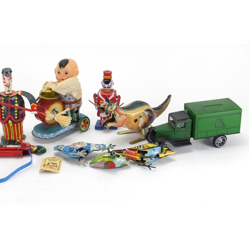 225 - Tin plate toys including clockwork rabbit and fairground ride