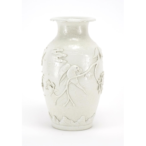 338 - Chinese porcelain Blanc de Chine vase, decorated in relief with birds of paradise amongst blossoming... 