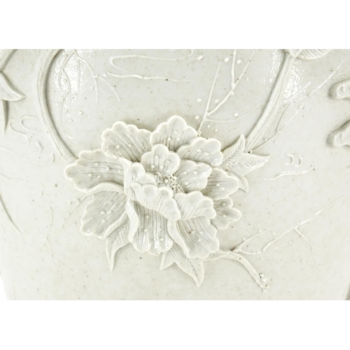 338 - Chinese porcelain Blanc de Chine vase, decorated in relief with birds of paradise amongst blossoming... 