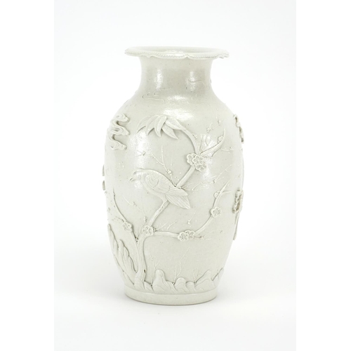 338 - Chinese porcelain Blanc de Chine vase, decorated in relief with birds of paradise amongst blossoming... 