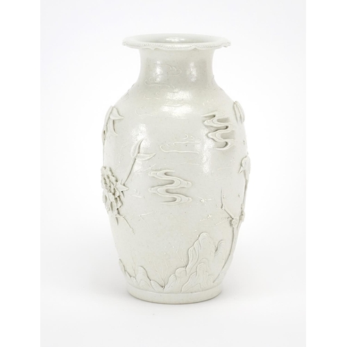 338 - Chinese porcelain Blanc de Chine vase, decorated in relief with birds of paradise amongst blossoming... 