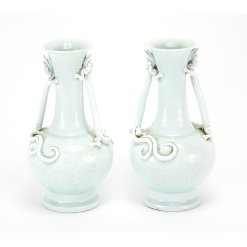 335 - Pair of Chinese celadon glazed vases, each with twin water dragon handles, the bodies incised with f... 