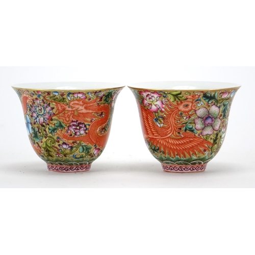 304 - Pair of Chinese porcelain dragon and phoenix fluted tea cups, each finely hand painted in the famill... 