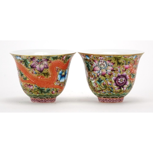 304 - Pair of Chinese porcelain dragon and phoenix fluted tea cups, each finely hand painted in the famill... 