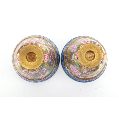 285 - Pair of Chinese porcelain tea cups, each finely hand painted in the famille rose palette with flower... 
