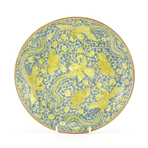 294 - Chinese porcelain shallow dish, hand painted in yellow with six phoenixes amongst flowers onto a blu... 