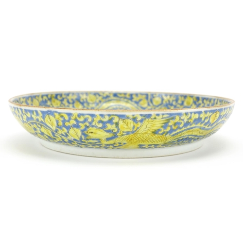 294 - Chinese porcelain shallow dish, hand painted in yellow with six phoenixes amongst flowers onto a blu... 