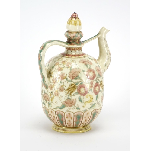 559 - Hungarian pottery wine ewer by Zsolnay Pecs, hand painted with flowers and foliage, factory marks to... 