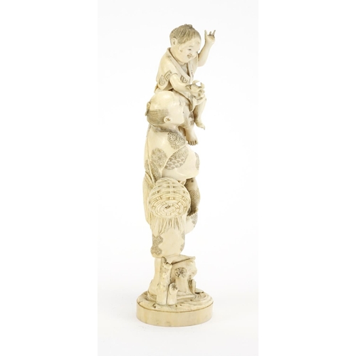 408 - Japanese carved ivory okimono of a fisherman with a child holding a crab, red inset character marks ... 