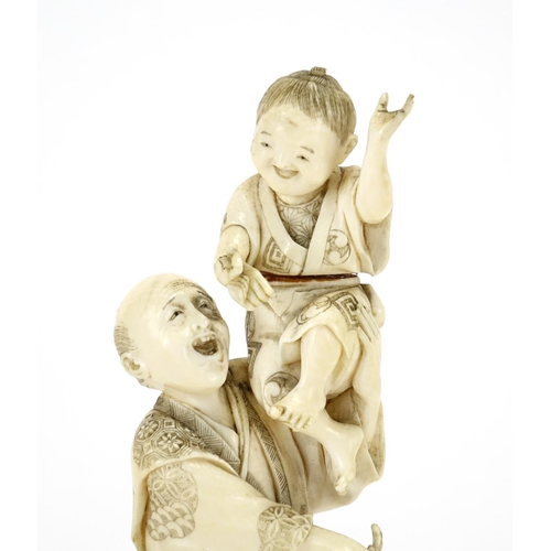 408 - Japanese carved ivory okimono of a fisherman with a child holding a crab, red inset character marks ... 