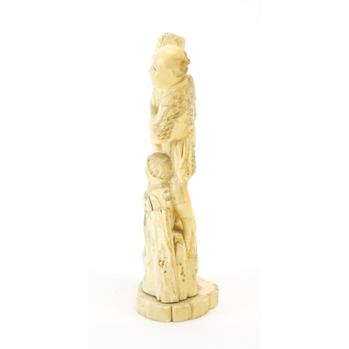 410 - Japanese carved ivory okimono of a fisherman and young boy, 18cm high