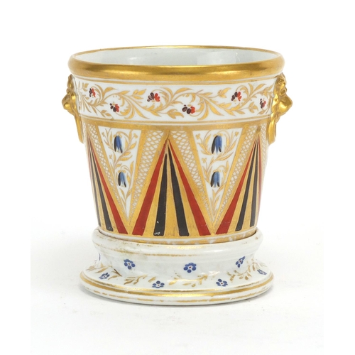 496 - 19th century porcelain Cache pot on stand with ring turned lions head handles, hand painted and gild... 