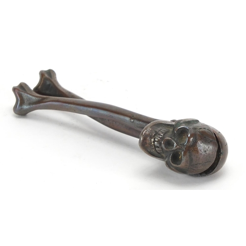 34 - Pair of bronze skull and cross bone design nutcrackers, impressed RD740411, 15.5cm in length