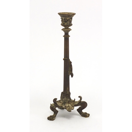 16 - 19th century patinated bronze candlestick with paw feet, the column decorated in relief with a lizar... 