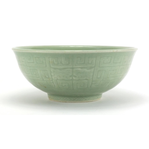 340 - Chinese celadon glazed footed bowl incised with a geometric repeat design, 26.5cm in diameter