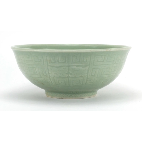 340 - Chinese celadon glazed footed bowl incised with a geometric repeat design, 26.5cm in diameter