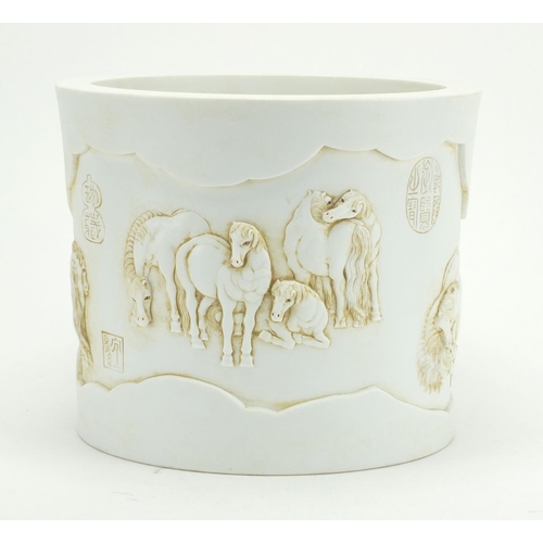 337 - Chinese white porcelain brusher pot, finely decorated in relief with horses at play, character marks... 