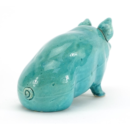 504 - Turquoise glazed pottery pig in the style of Wemyss, 10cm high