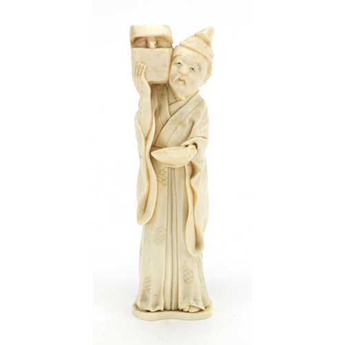 407 - Japanese carved ivory okimono of an elder holding a box, character marks to the base, 12.5cm high