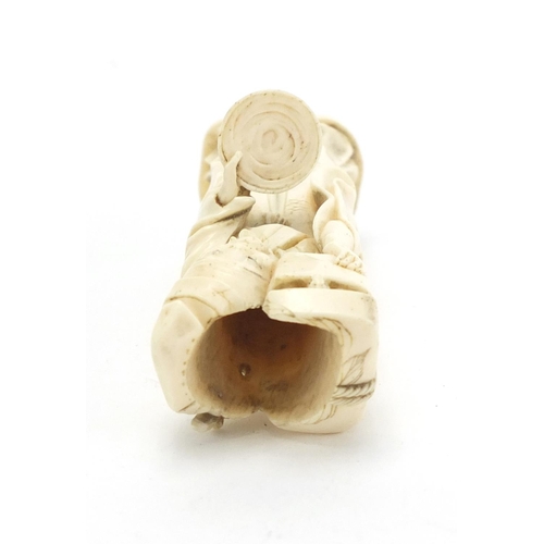 407 - Japanese carved ivory okimono of an elder holding a box, character marks to the base, 12.5cm high