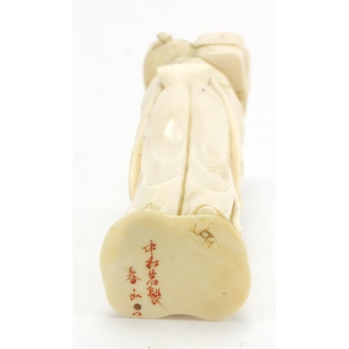 407 - Japanese carved ivory okimono of an elder holding a box, character marks to the base, 12.5cm high