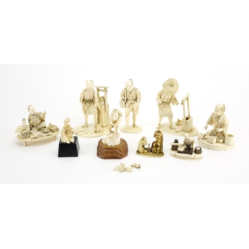 406 - Japanese carved ivory okimono's including a man holding a fan and a fisherman, some with character m... 