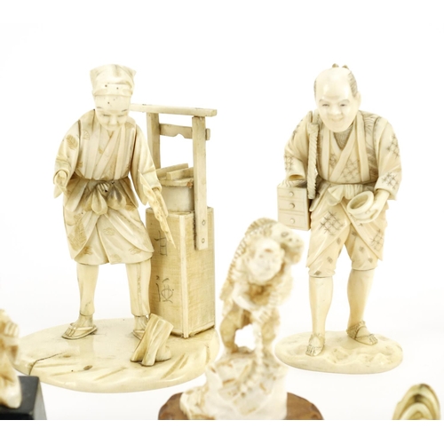 406 - Japanese carved ivory okimono's including a man holding a fan and a fisherman, some with character m... 