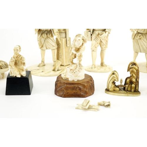 406 - Japanese carved ivory okimono's including a man holding a fan and a fisherman, some with character m... 