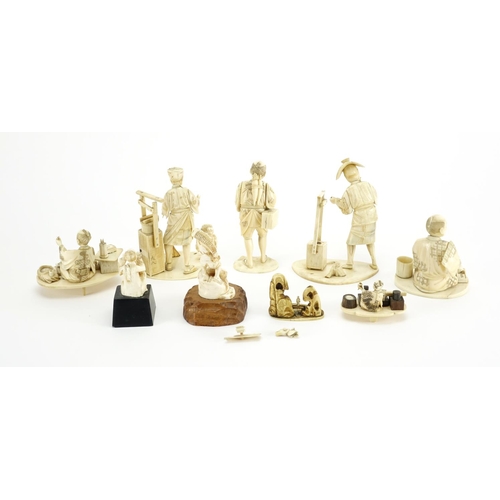 406 - Japanese carved ivory okimono's including a man holding a fan and a fisherman, some with character m... 