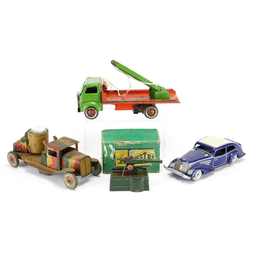 133 - Three vintage tin plate vehicles and an Astra fort gun with box, the vehicles including an army truc... 