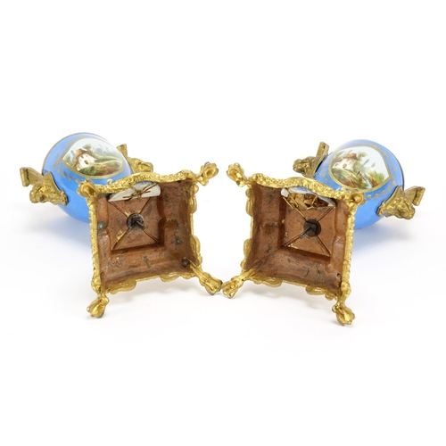 489 - Pair of 19th century Sevres style vase garnitures with twin lions head handles, each hand painted wi... 