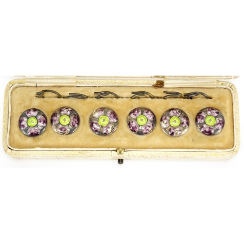 593 - Set of six Arts & Crafts silver and enamel flower head buttons, by James Fenton housed in a fitted t... 