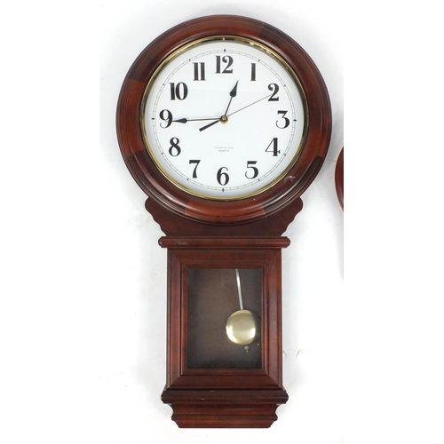 92 - Two mahogany wall hanging clocks, the largest with Westminster chime, 76cm in length