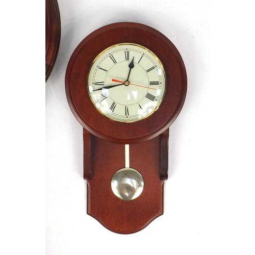 92 - Two mahogany wall hanging clocks, the largest with Westminster chime, 76cm in length