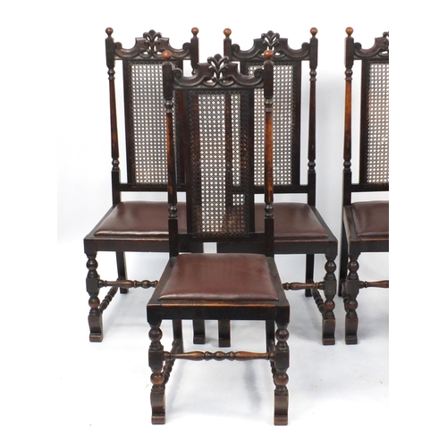 30 - Set of six carved oak dining chairs with bergère backs and brown leather seats, 116cm high
