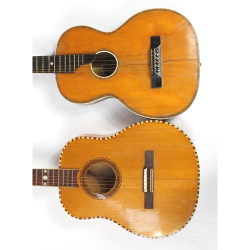 146 - Two vintage inlaid six string acoustic guitars, the largest 99cm high