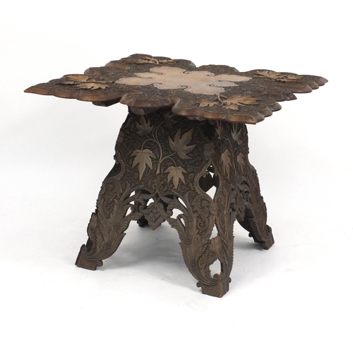 2035 - Anglo Indian hardwood folding table, profusely carved with fruiting leaves, 62cm H x 72cm W x 72cm D