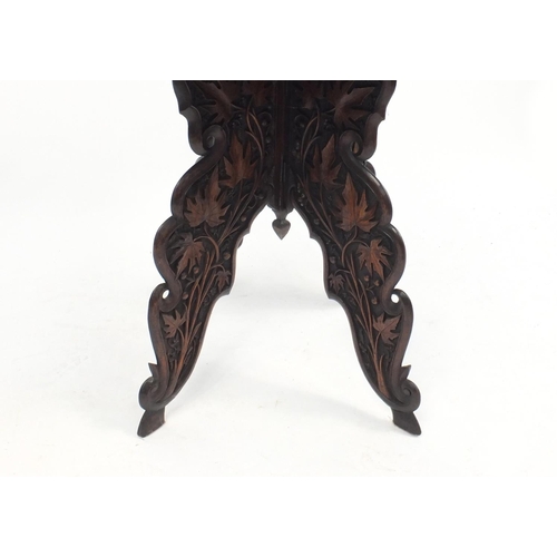 2039 - Anglo Indian folding table profusely carved with fruiting leaves, 62cm H x 60cm W x 60cm D