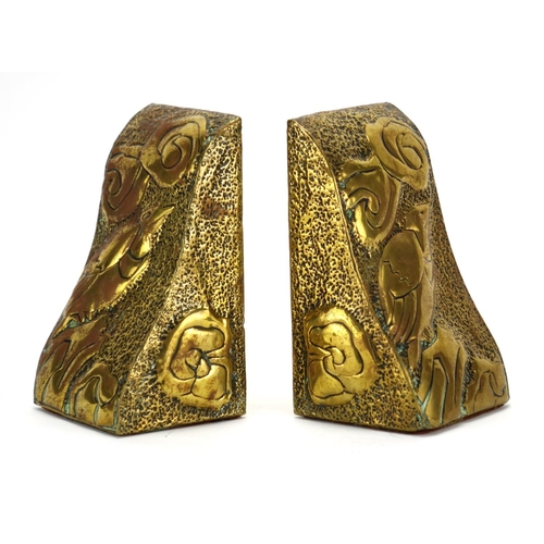 585 - Pair of Scottish school Arts & Crafts brass bookends, each embossed with stylised a bird, each 15.5c... 