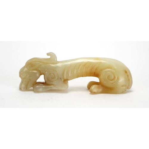 399 - Chinese white amd russet jade carving of a mythical animal, 9cm in length