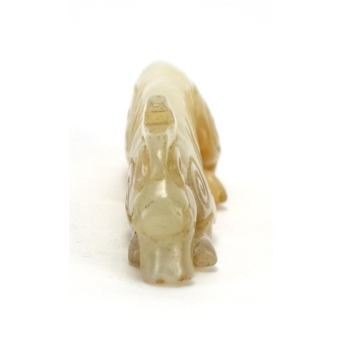 399 - Chinese white amd russet jade carving of a mythical animal, 9cm in length