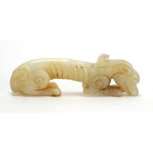 399 - Chinese white amd russet jade carving of a mythical animal, 9cm in length