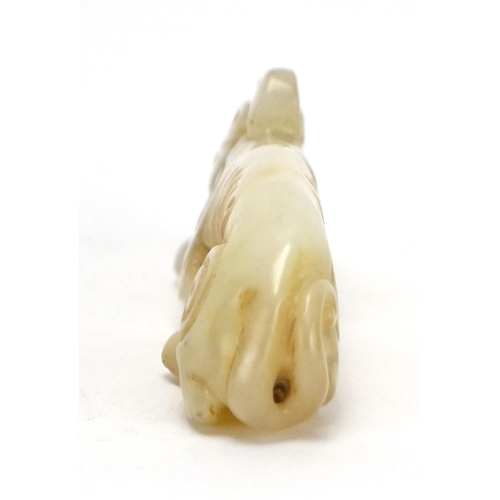 399 - Chinese white amd russet jade carving of a mythical animal, 9cm in length