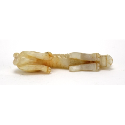 399 - Chinese white amd russet jade carving of a mythical animal, 9cm in length