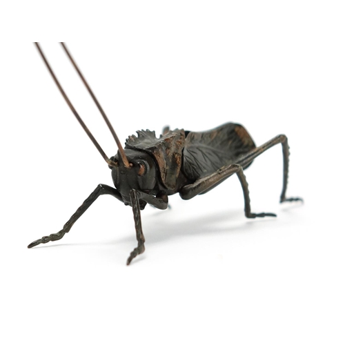 362 - Japanese bronze locus with articulated legs, body and antennae's, character marks to the base, 7cm h... 