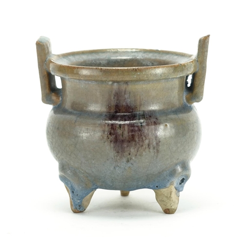 344 - Chinese pottery tripod censer with twin handles, having a turquoise and purple glaze, 12.5cm high